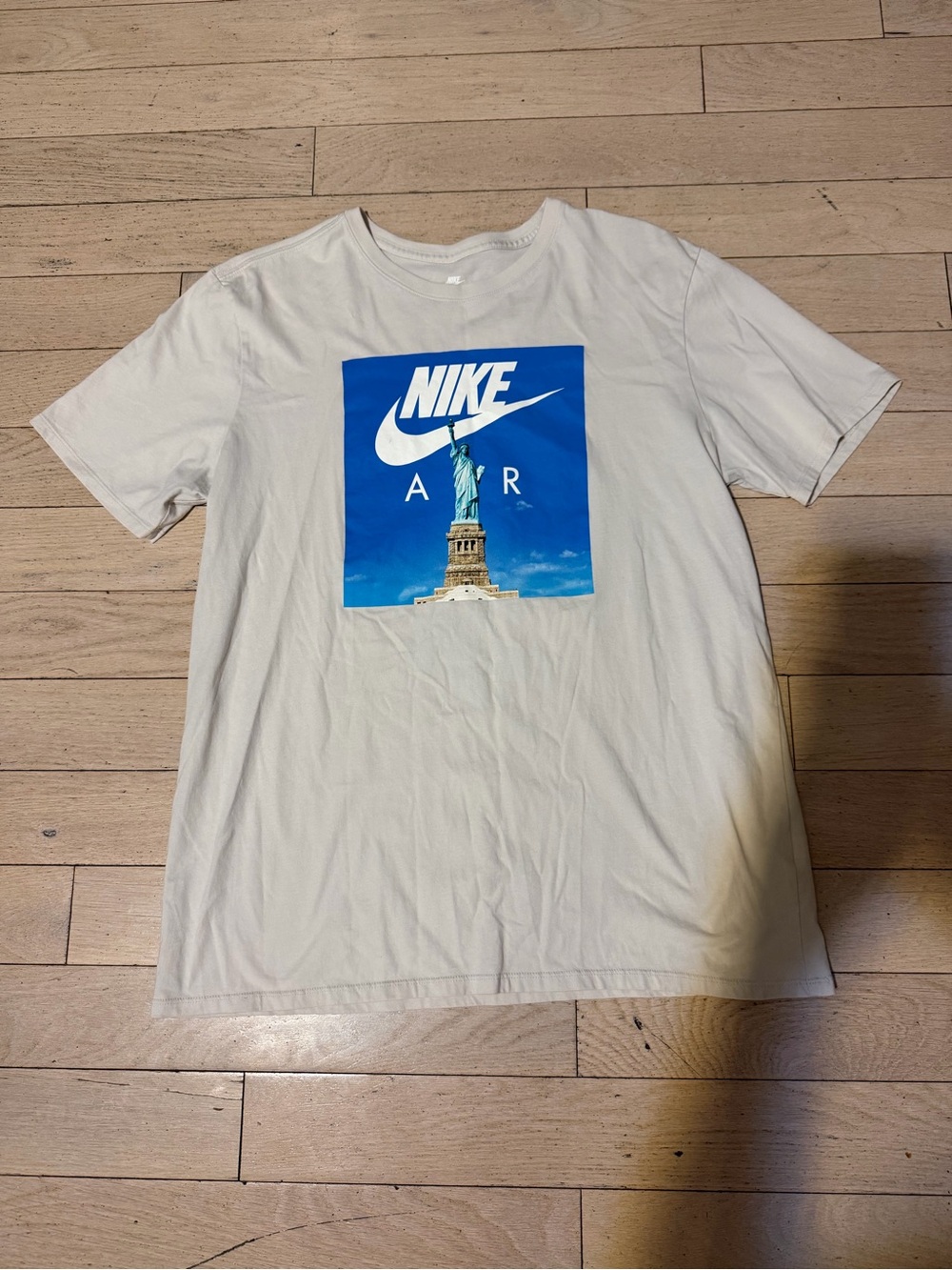 Nike White Short Sleeve Tee with Statue of Liberty Graphic